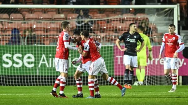 Kian Leavy celebrates with Chris Forrester and Anto Breslin after firing home the winner