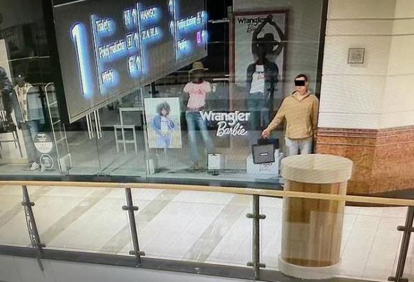 The man posed in the shop window. Credit: Warsaw Police